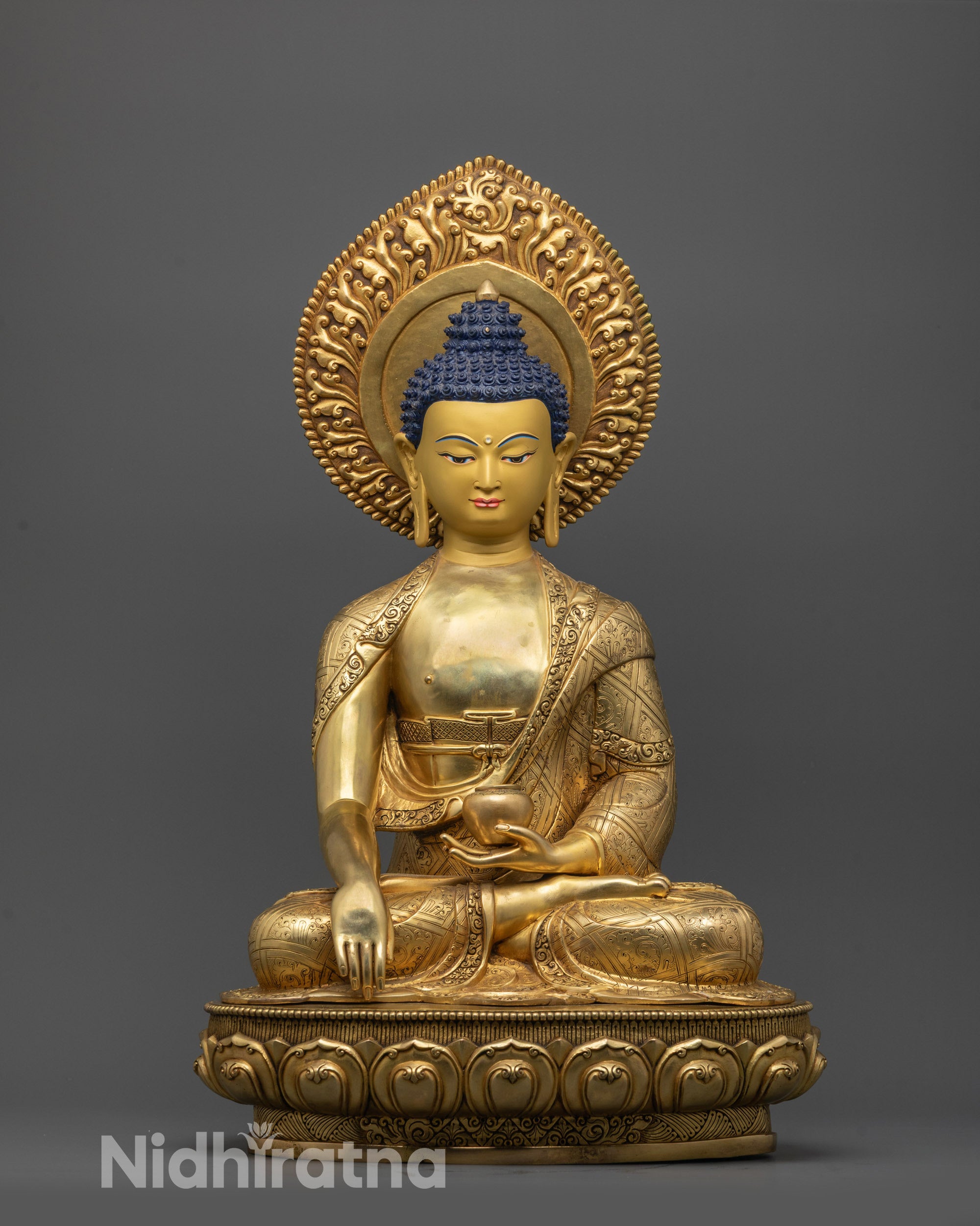 Front view of 24K Fire Gold Gilded Buddha Shakyamuni Statue with serene facial expression