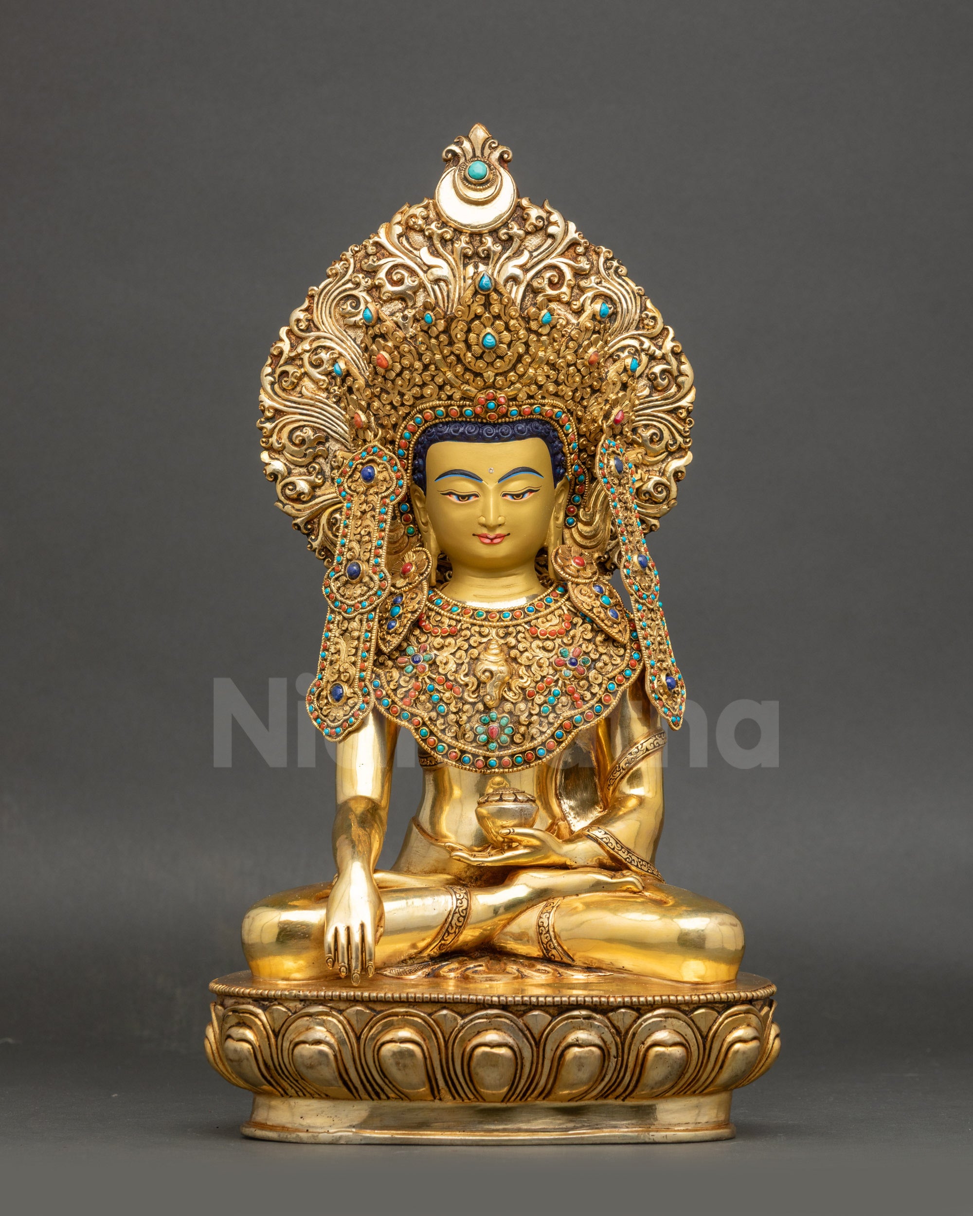Front view of 24K gold fire-gilded Jowo Shakyamuni Buddha seated on lotus pedestal
