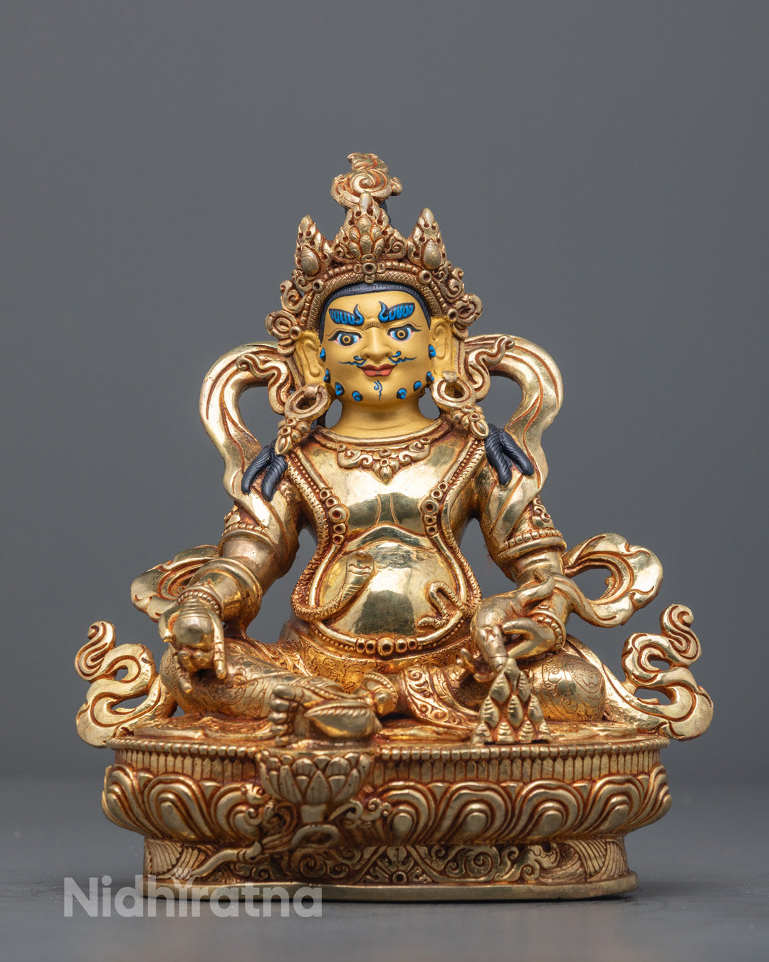 24k gold-gilded Dzambhala Statue seated on a lotus base with jeweled crown and mongoose