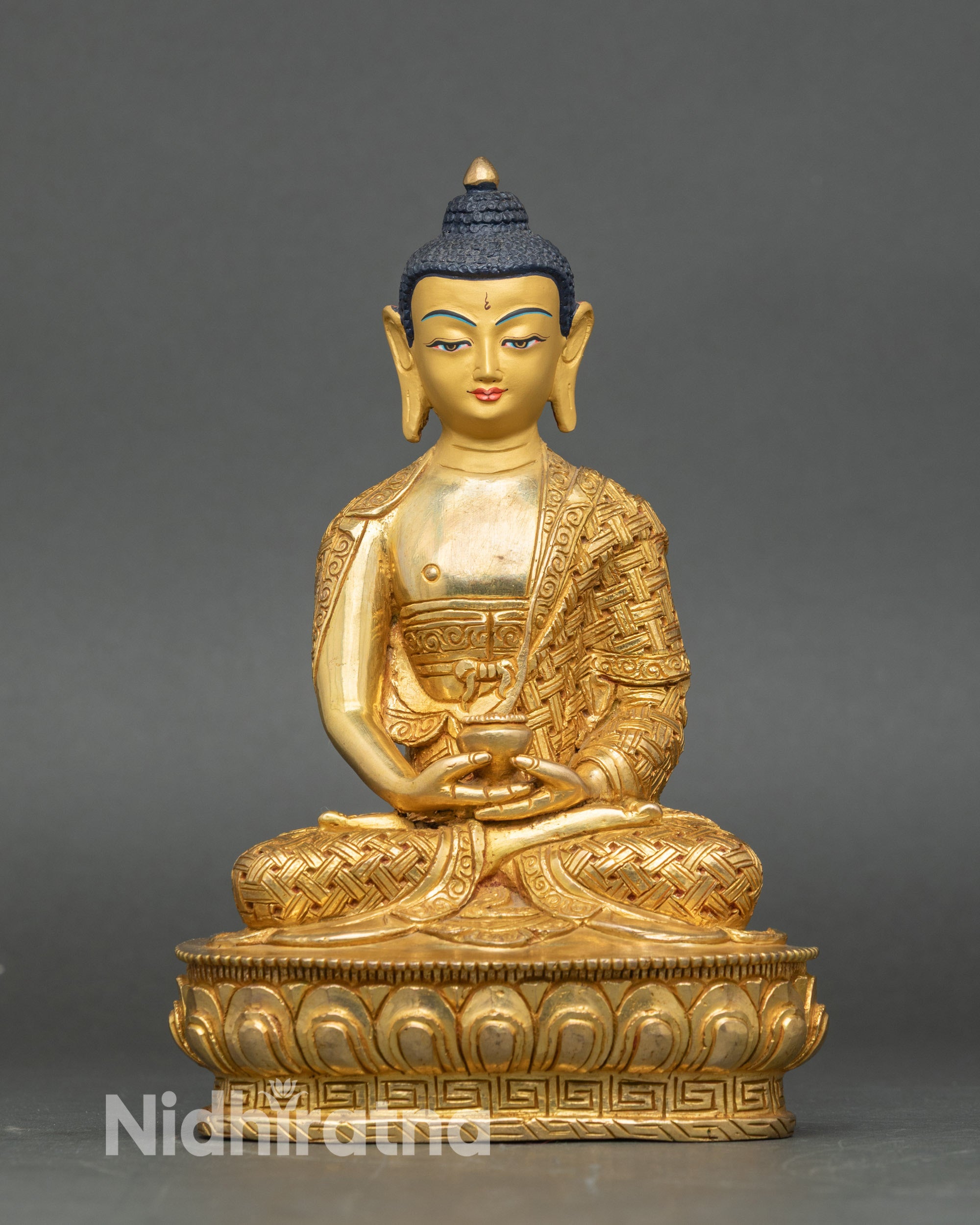 Front view of Amitabha Buddha statue, gold fire-gilded copper, seated on lotus throne