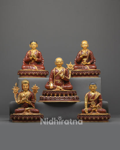 Front view of Artisan-Crafted Sakya Masters Set with gold-gilded faces and lama robes
