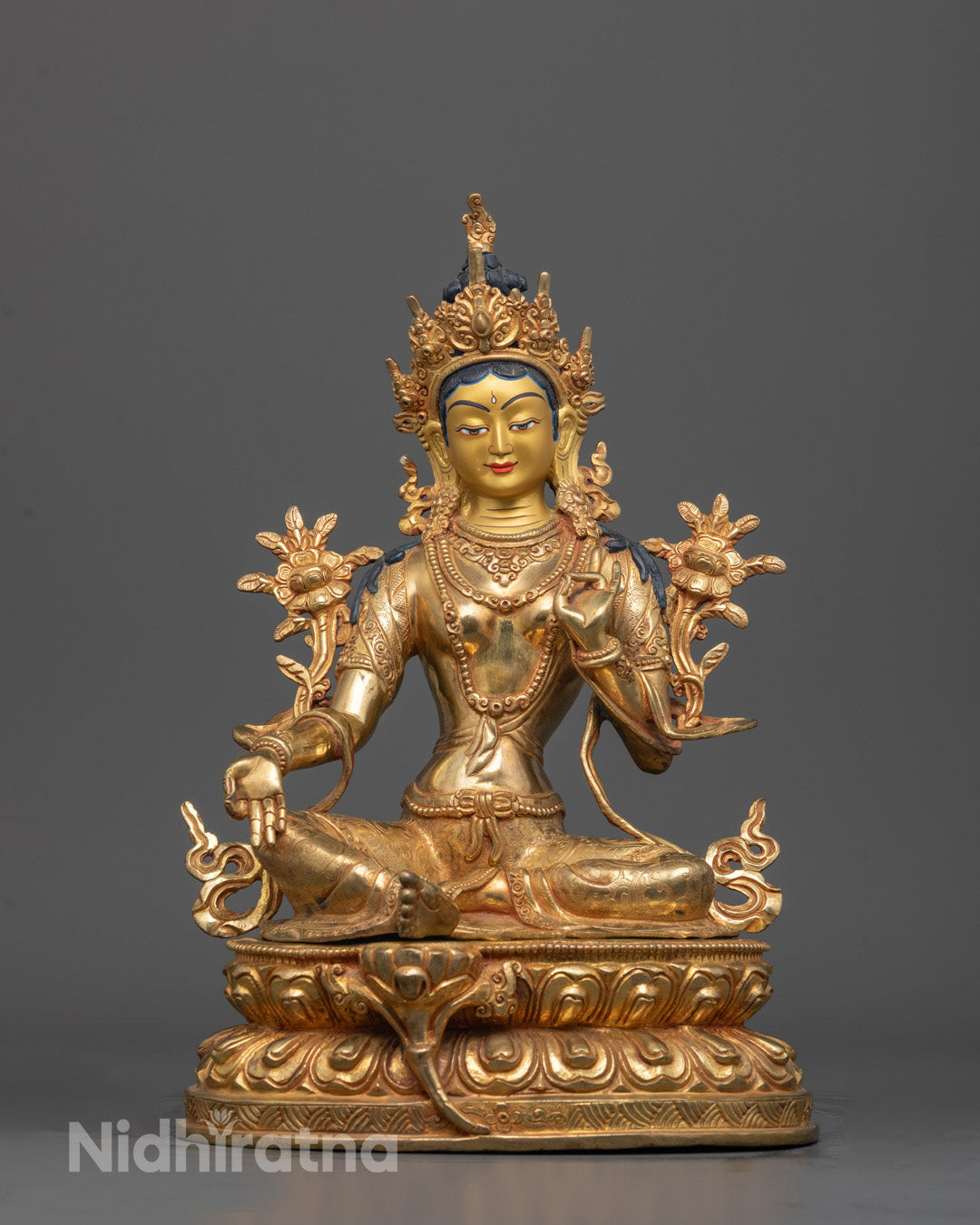 Front view of Authentic Green Tara Statue with gold-gilded face and intricate carvings
