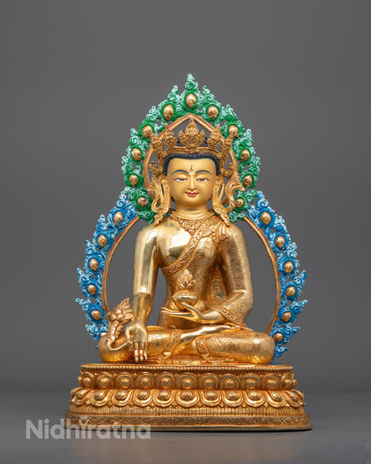 Front view of Bhaisajyaguru Healing Buddha statue with gold-gilded face and lotus throne