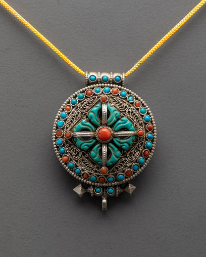 Front view of Bishwo Vajra Locket with turquoise, coral, lapis on silver filigree body