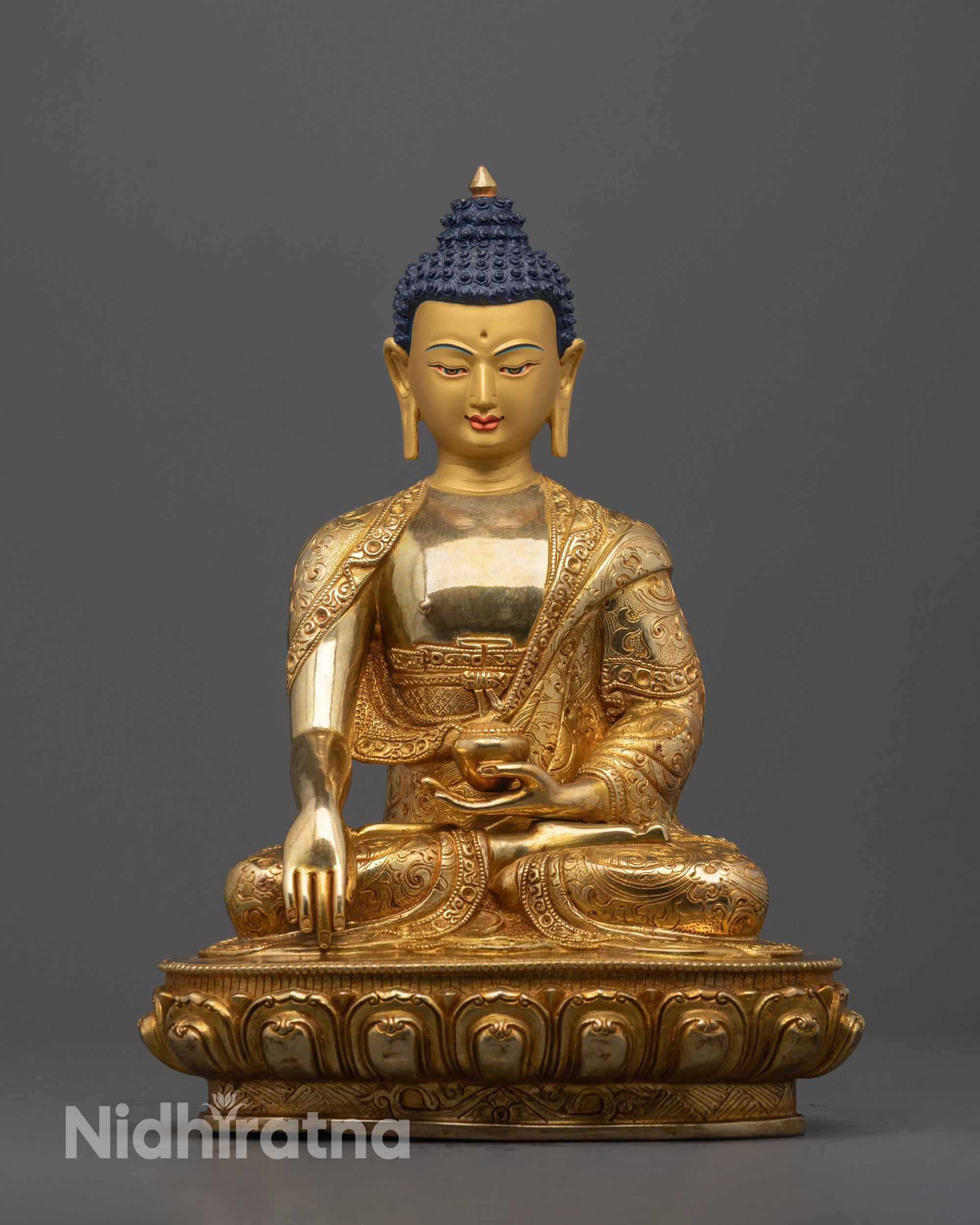 Front view of Buddha Shakyamuni Statue with gold-gilded face in Bhumisparsa Mudra