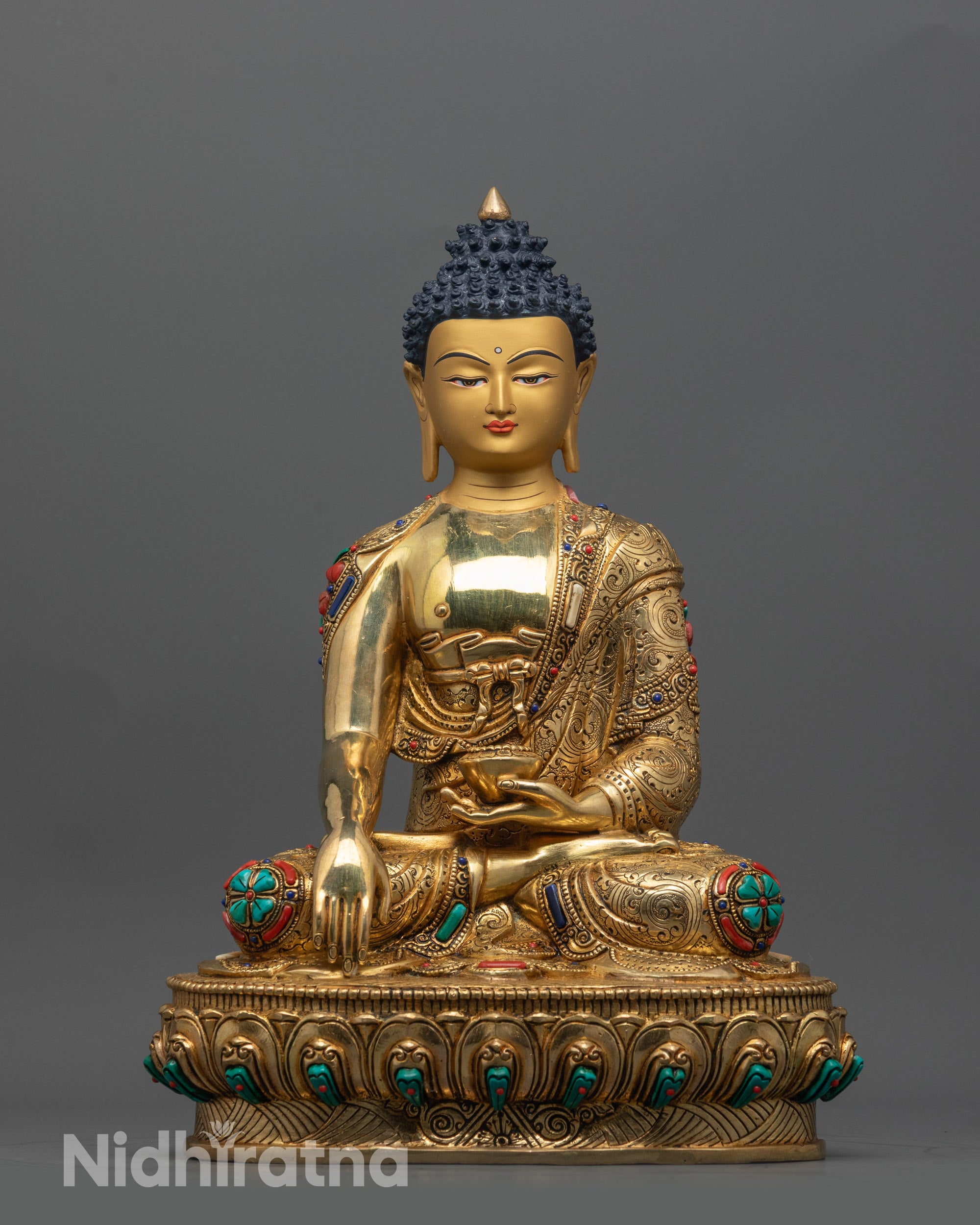 Front view of Buddha Shakyamuni Statue with gold-gilded face and lotus pose seated figure