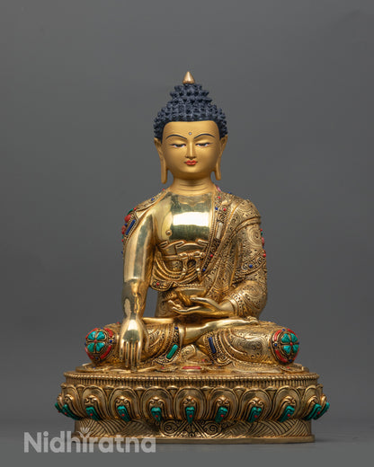 Front view of Buddha Shakyamuni Statue with gold-gilded face and lotus pose seated figure