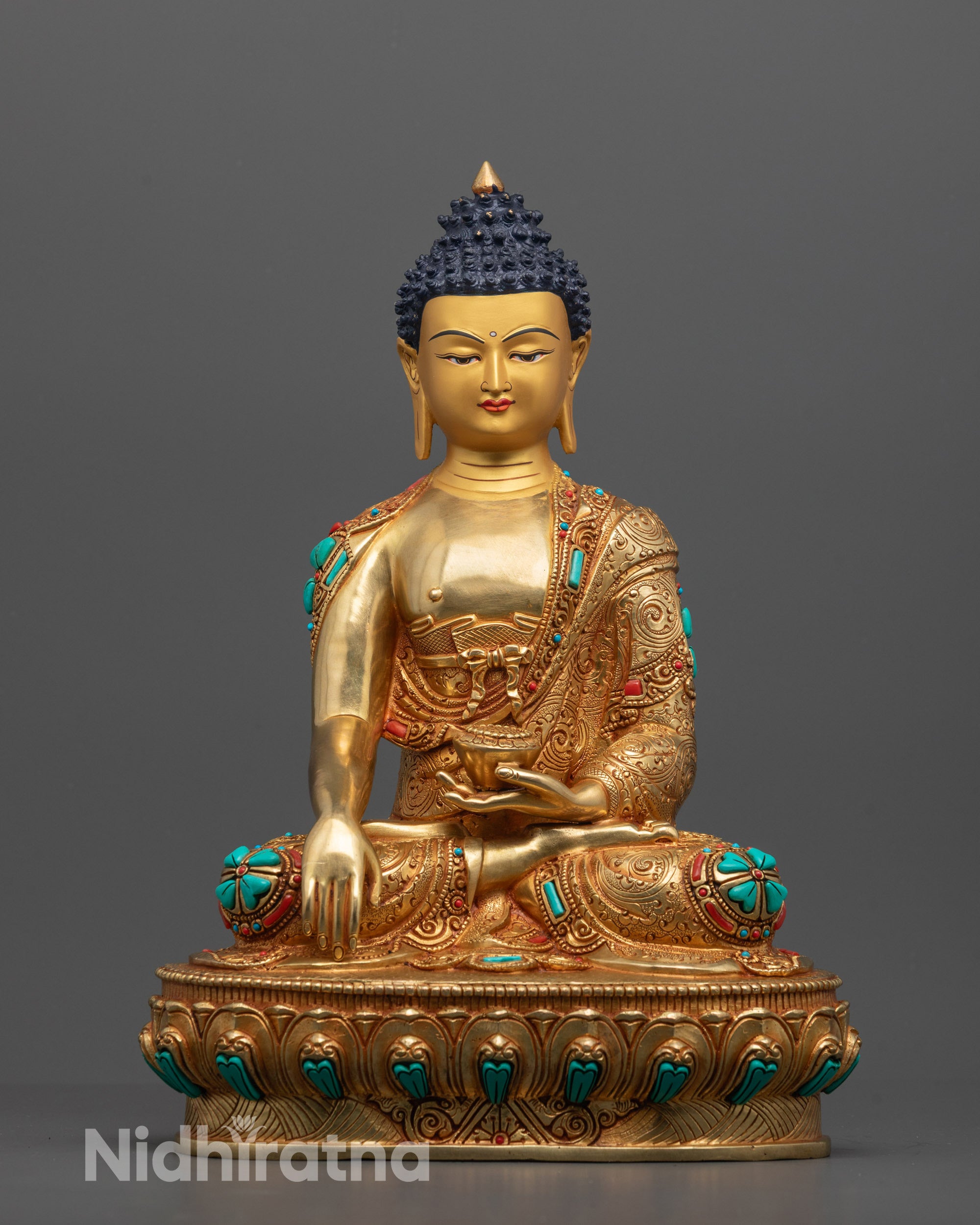 Front view of Buddha Shakyamuni Statue with gold-gilded face and lotus seat details