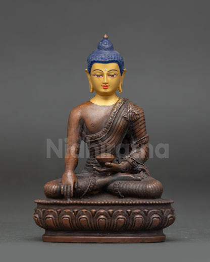 Front view of Buddha Shakyamuni statue seated on a lotus with a serene expression