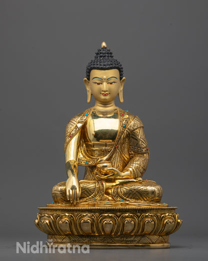 Front view of Buddha Shakyamuni statue with gold-gilded face and lotus throne from Nepal
