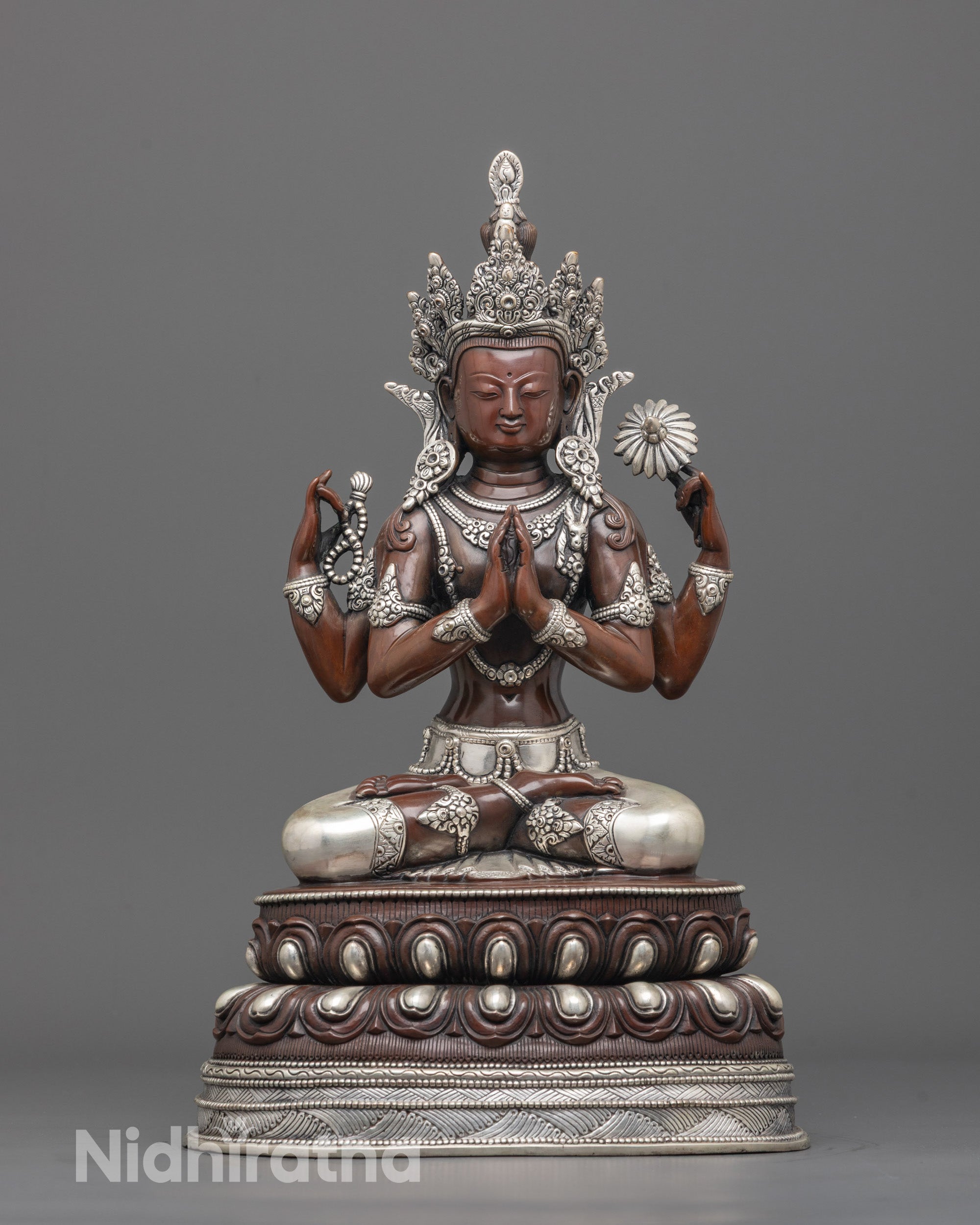 Front view of Buddhist Oxidized Chenrezig Statue showing four arms and silver-plated details