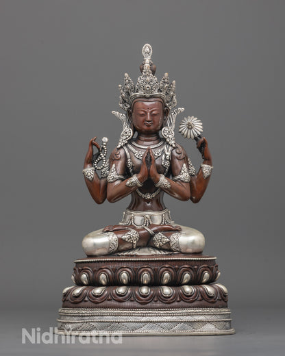 Front view of Buddhist Oxidized Chenrezig Statue showing four arms and silver-plated details