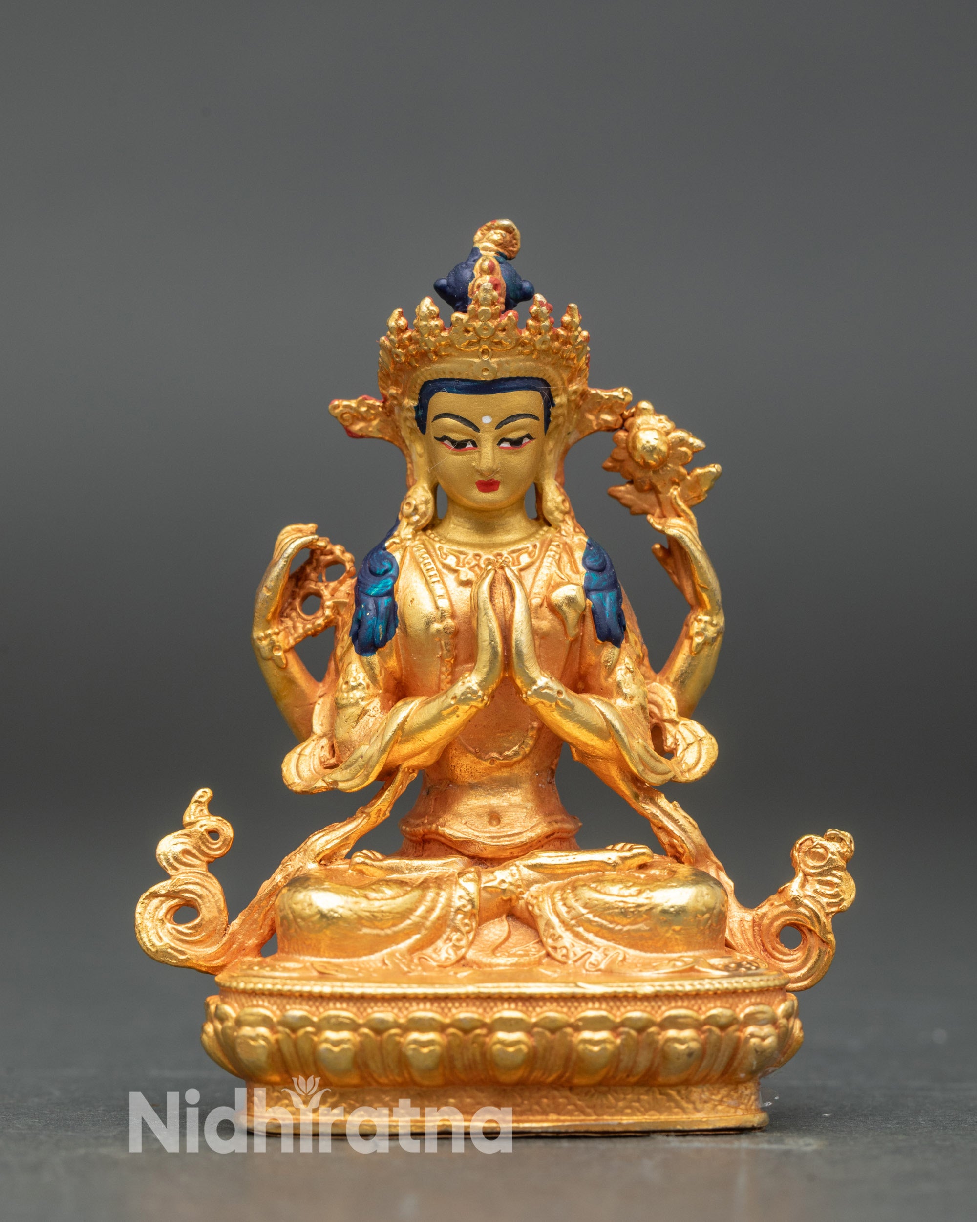 Front view of Chenrezig statue from Nepal, gold fire-gilded body with 24K gold face