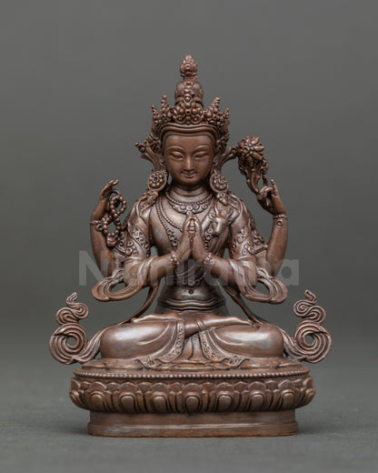 Front view of Chenrezig statue holding crystal rosary and lotus, seated on lotus pedestal