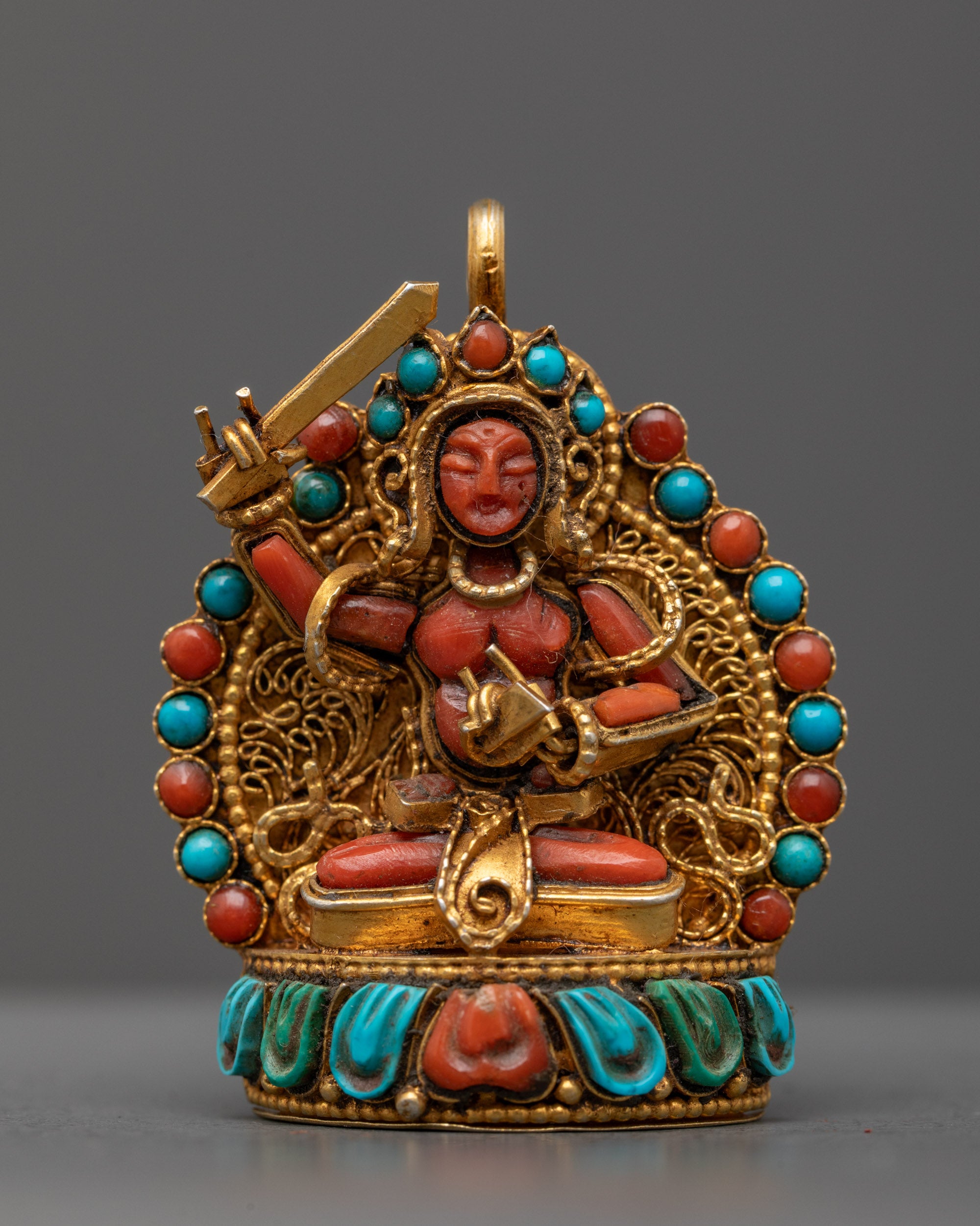 Front view of Coral Manjushri Locket with gold filigree, semi-precious stones, Nepal artisan