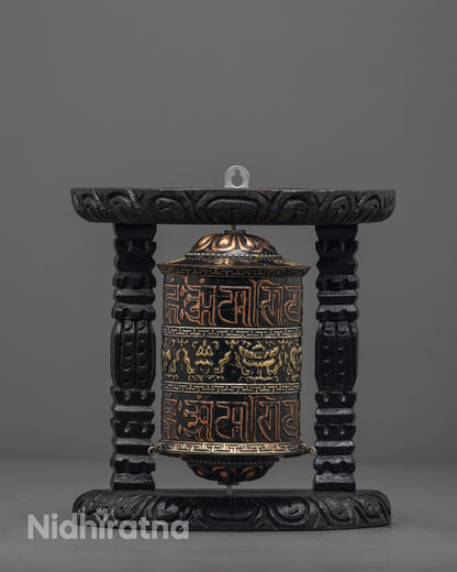 Front view of Decorative Buddhist Prayer Wheel with carved copper and brass finish
