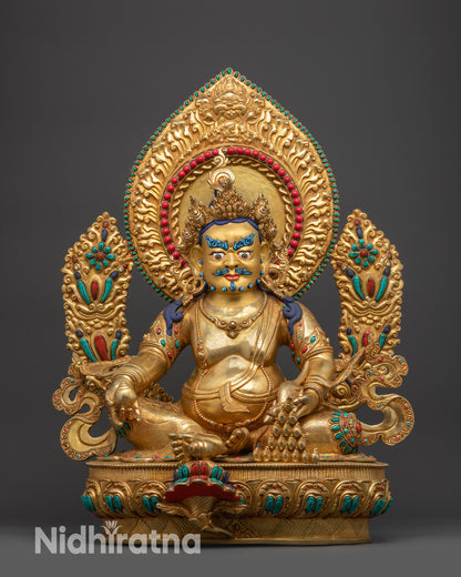 Front view of Divine Dzambhala Sculpture with gold-gilded face and lotus seat
