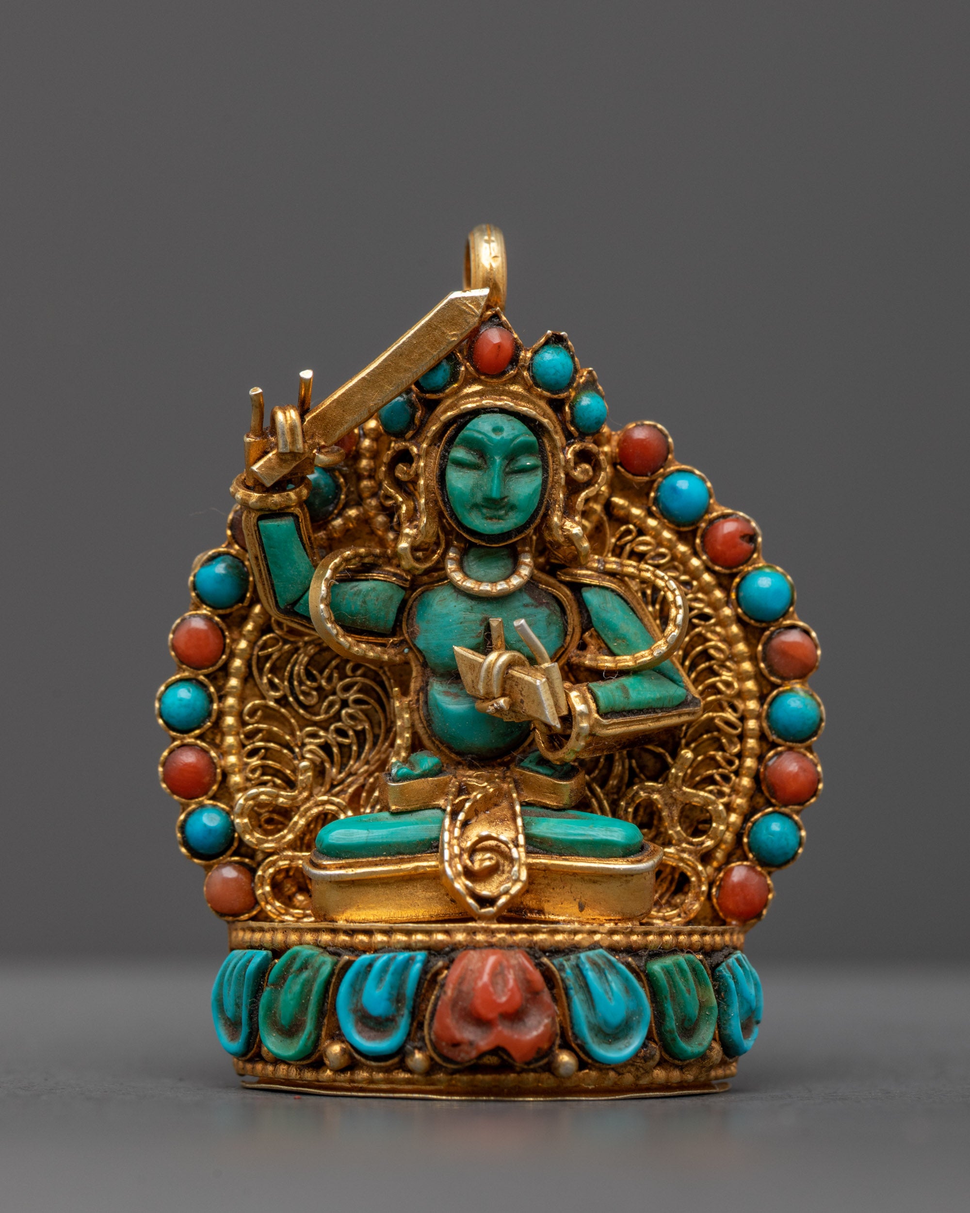 Front view of Divine Manjushri Pendant with turquoise Manjushri and gold sword, Patan Nepal