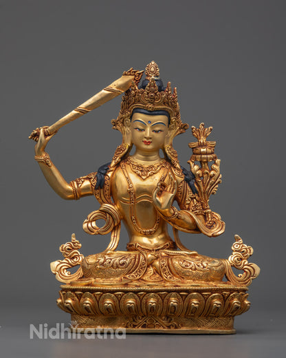 Front view of Divine Manjushri Statue with gold-gilded face and intricate lotus base carvings