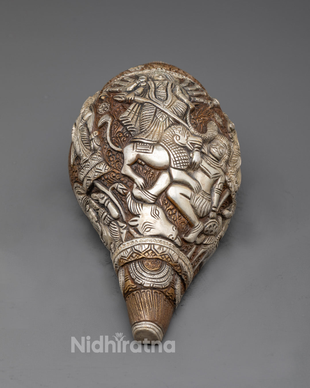 Front view of Durga Devi Conch Shell with goddess carvings, ideal for altar or home worship