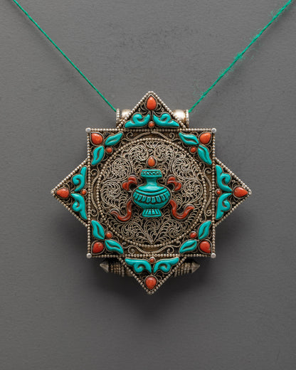 Front view of Exquisite Treasure Vase Locket Necklace with coral, turquoise, and silver filigree design