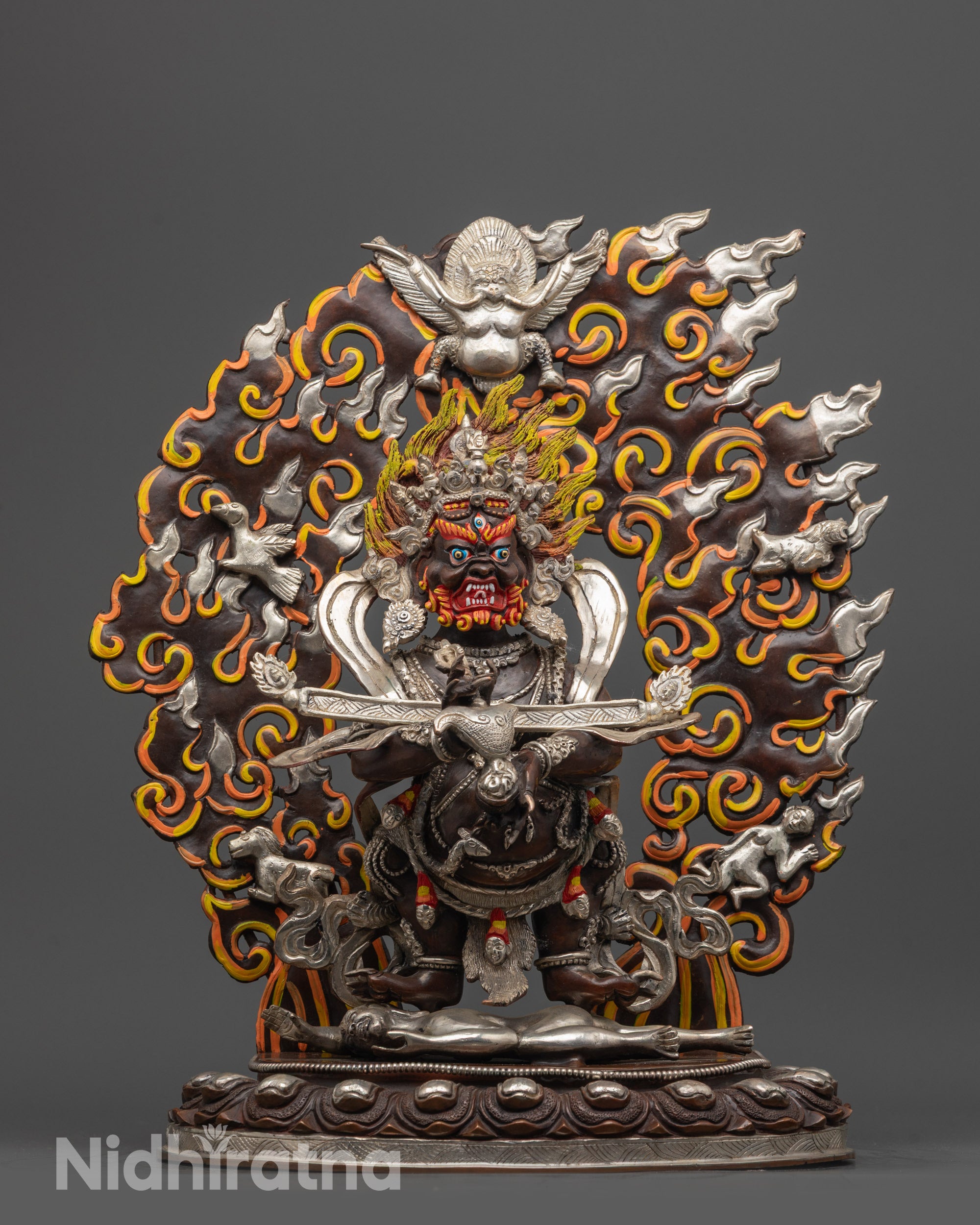 Front view of Fierce Shakya Mahakala Statue on lotus seat with silver-plated finish