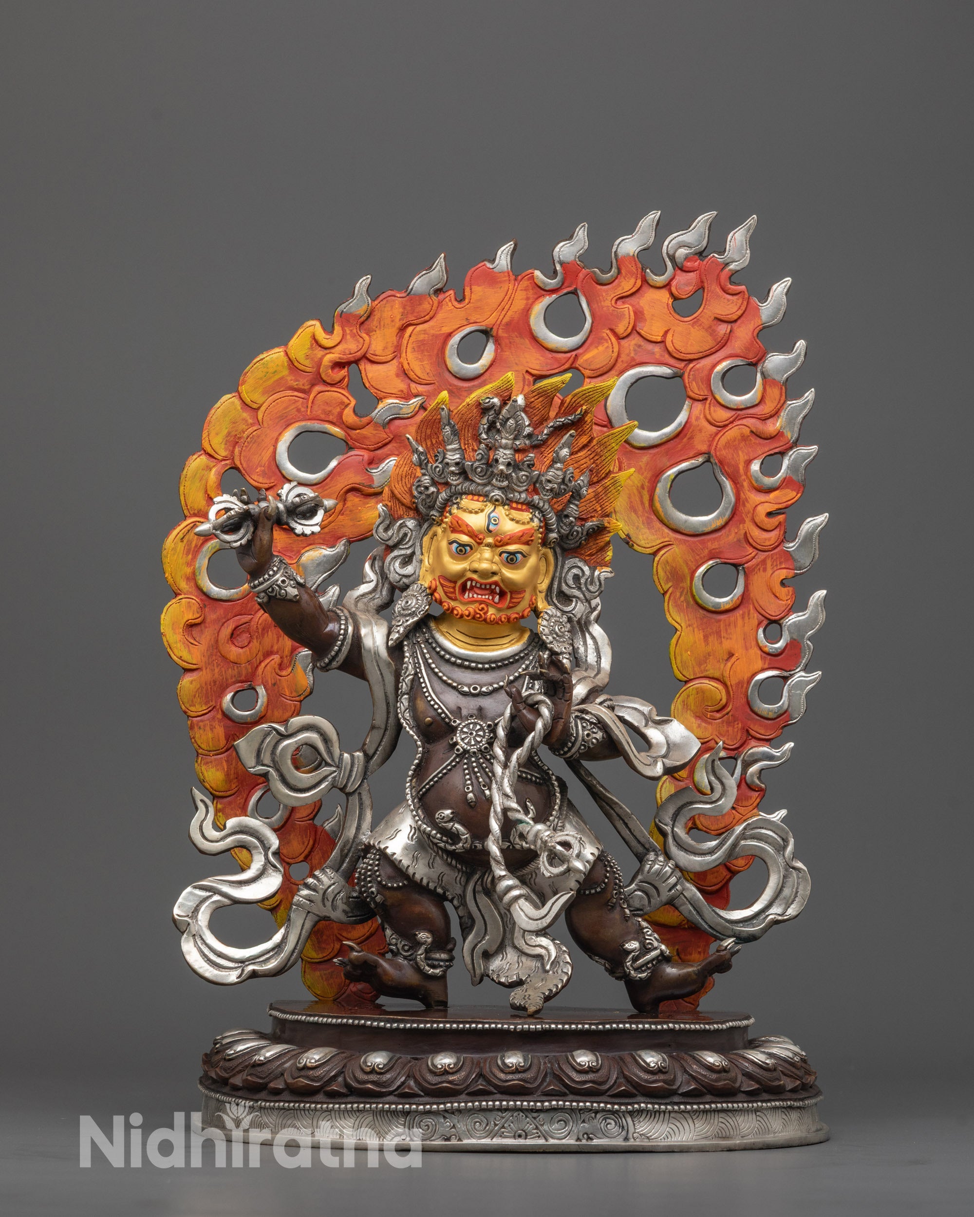 Front view of Fierce Vajrapani Statue with wrathful flame halo and lotus seat in oxidized copper