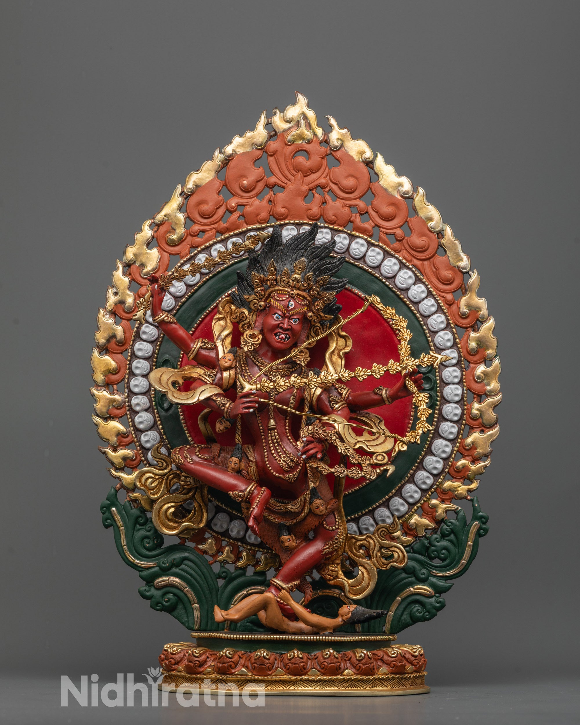 Front view of Goddess Kurukulla Statue on gold-plated lotus with vibrant red hue