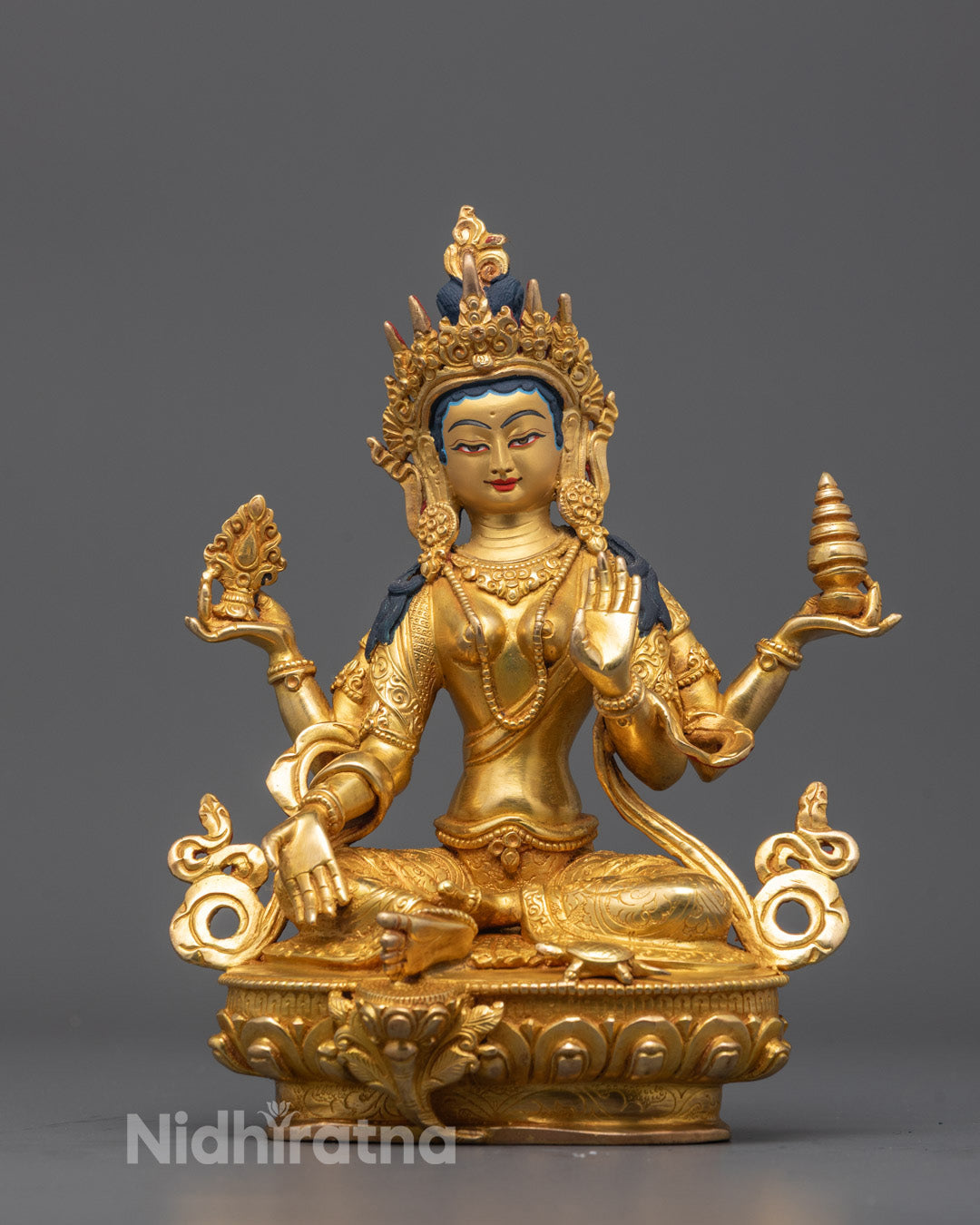 Front view of Goddess Laxmi statue with gold-gilded face and blessing mudra