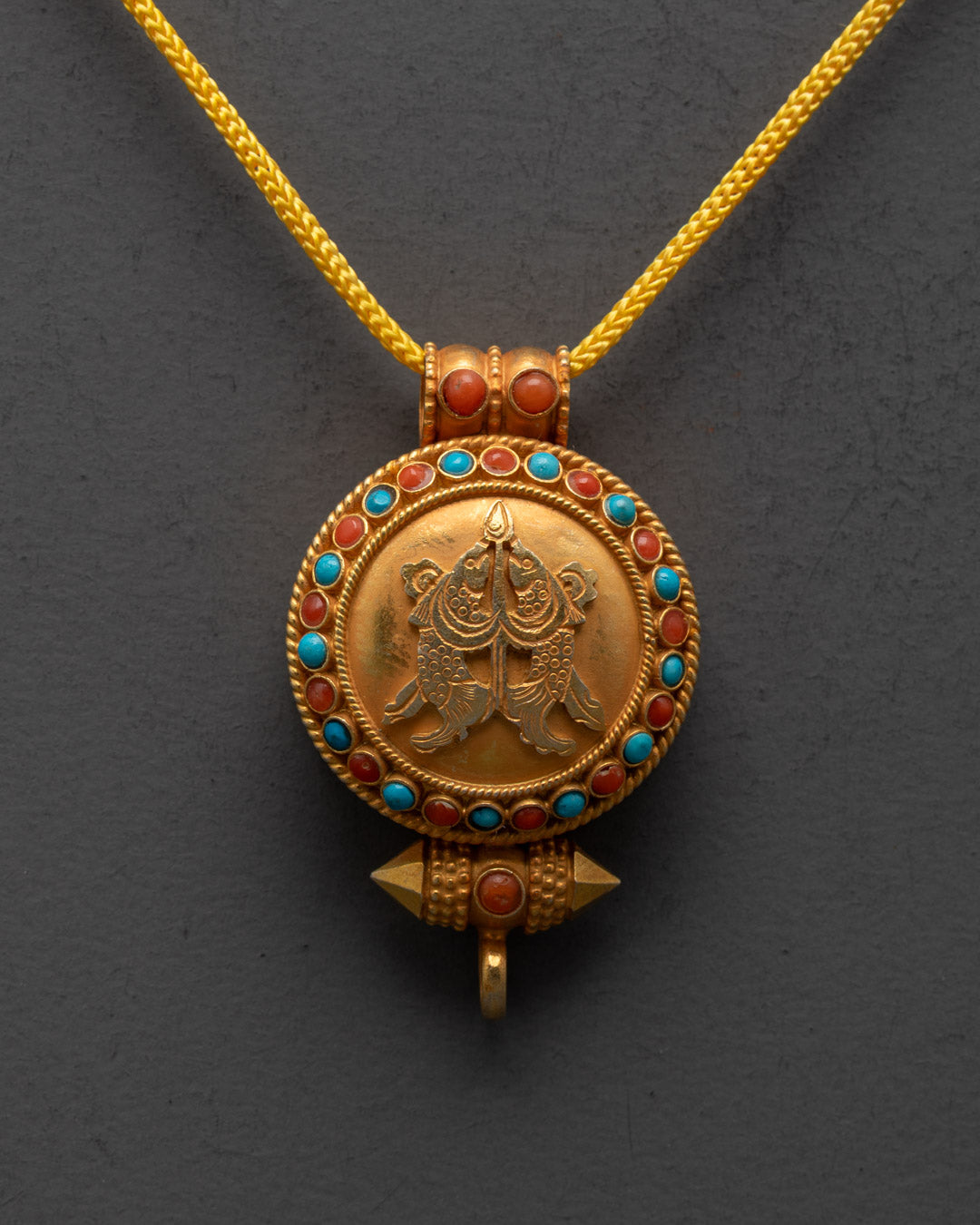 Front view of Golden Fish Ghau Pendant with gold gilding and semi-precious stones