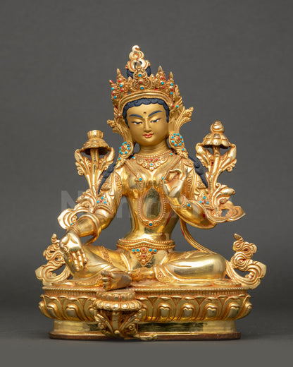 Front view of Green Tara Figurine seated on lotus with gold crown and utpala flowers
