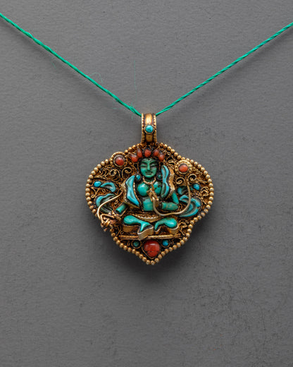Front view of Green Tara Locket with green crystal deity, turquoise stones, and gold-gilded filigree, handcrafted by artisans in Patan, Nepal.