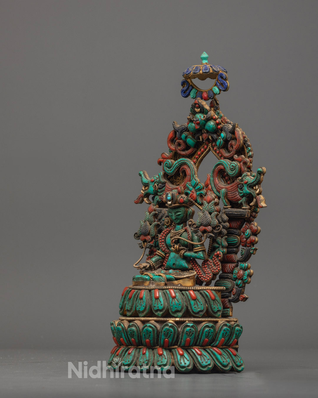 Green Tara Statue in meditation pose with colorful accents and silver-plated detailing by skilled artisans