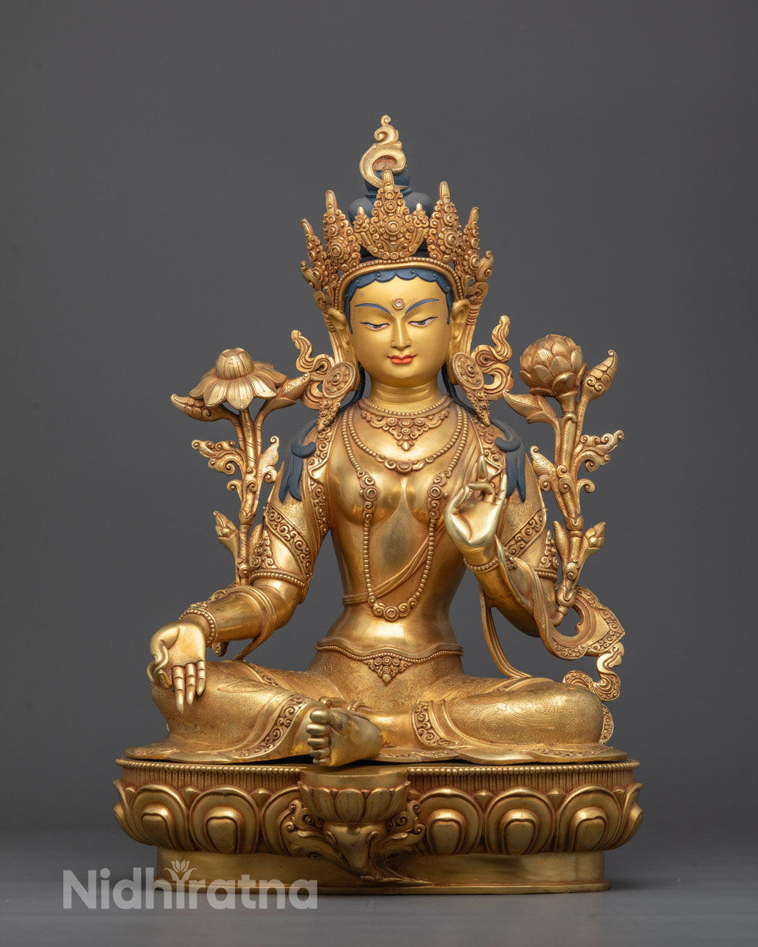 Front view of Green Tara Statue seated on lotus base in meditative posture 