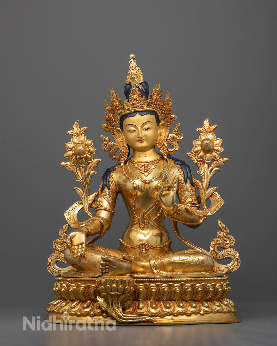 Front view of Green Tara Statue seated on lotus base in varada mudra