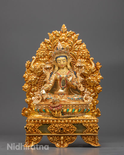 Front view of Green Tara sculpture with 24k gold face and lotus throne details