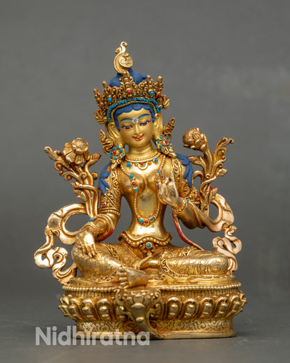 Front view of Green Tara statue, gold fire-gilded copper with lotus seat