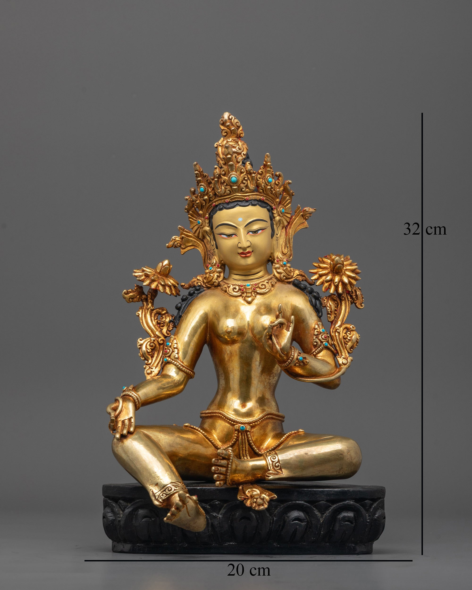 Front view of Green Tara statue on lotus base with gold finish and serene expression

