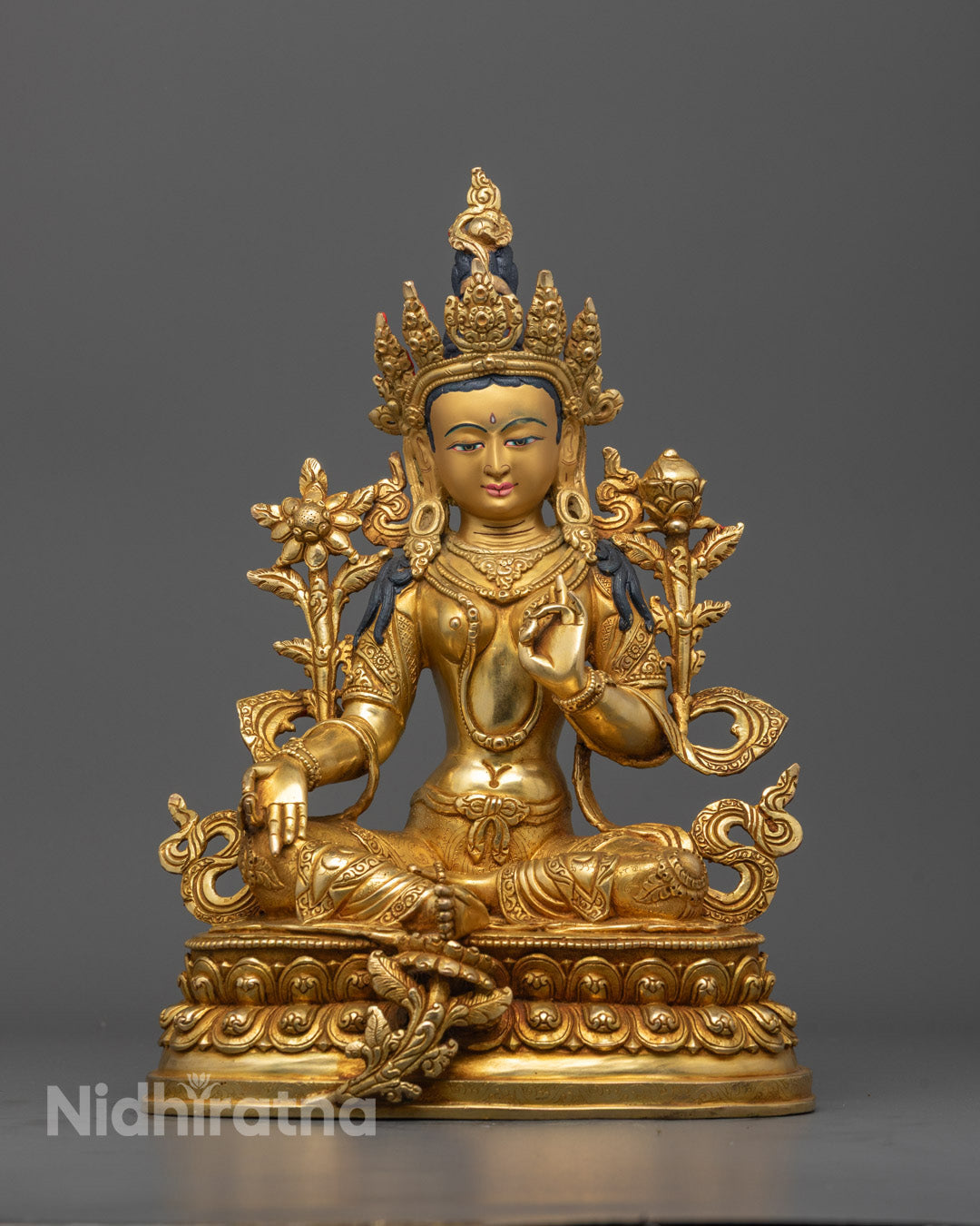Front view of Green Tara statue with gold-gilded face and double-layered lotus base
