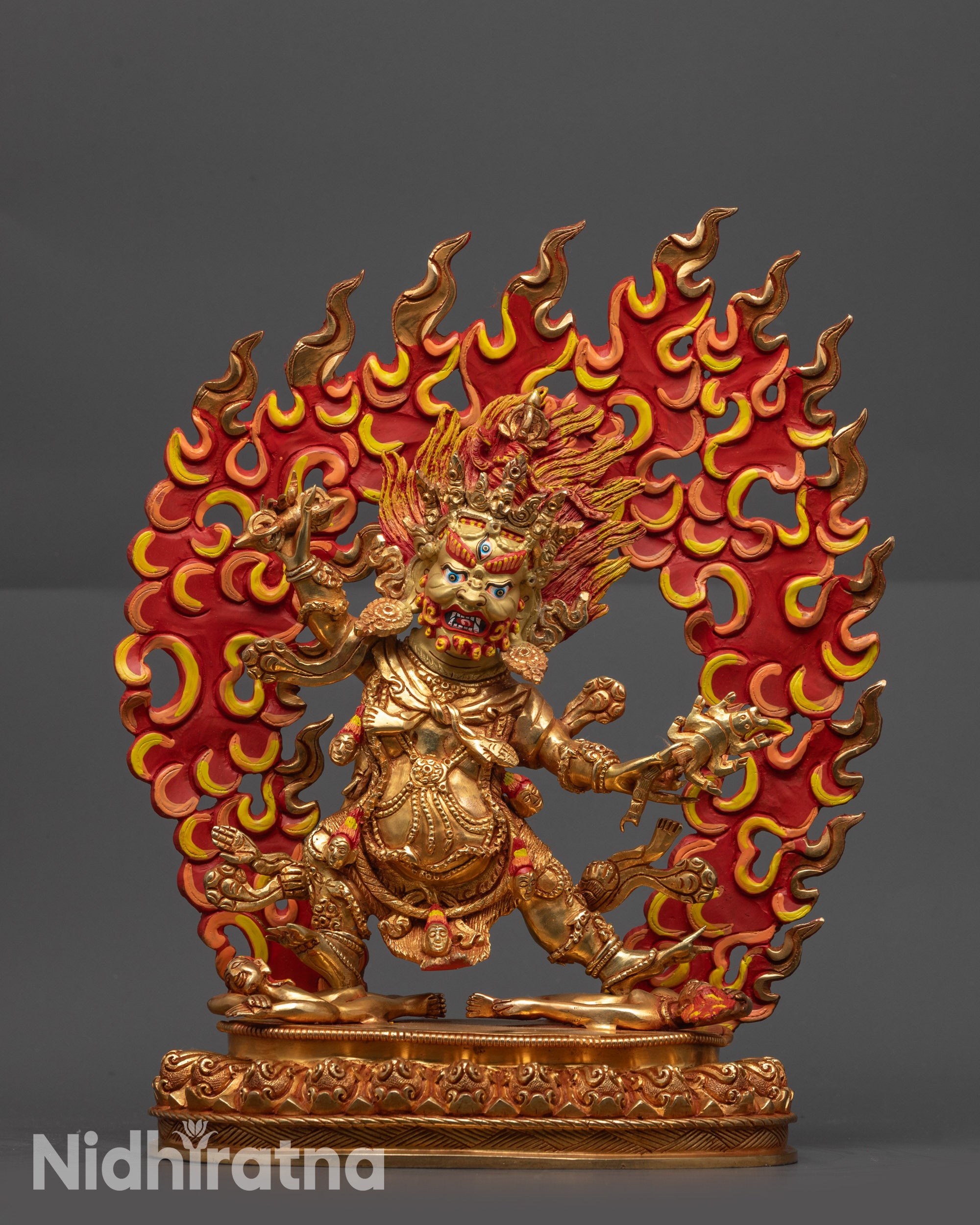 Guru Dragpo wrathful deity statue, gold gilded copper with flames symbolizing protection and transformation.