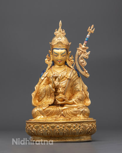 Front view of Guru Padma Vajra Statue with gold-gilded face and Tripitaka robe

