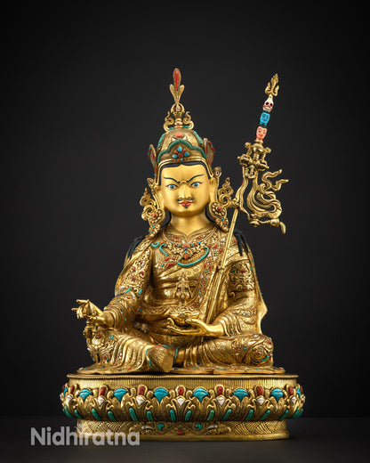 Front view of Guru Padmasambhava statue with lotus hat and gold-gilded finish
