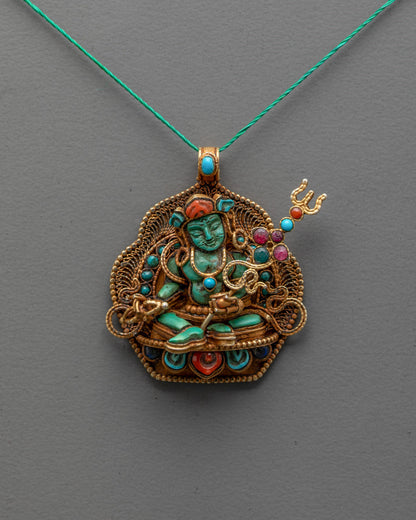 Front view of Guru Rinpoche Pendant with turquoise body and coral lotus crown