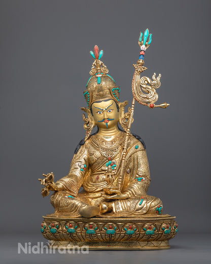 Front view of Guru Rinpoche Sculpture with gold-gilded face and fire-gilded body, seated on a moon disc adorned with semi-precious stones