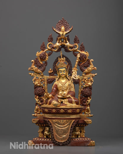 Front view of Guru Rinpoche Statue with gold-gilded face and oxidized copper body
