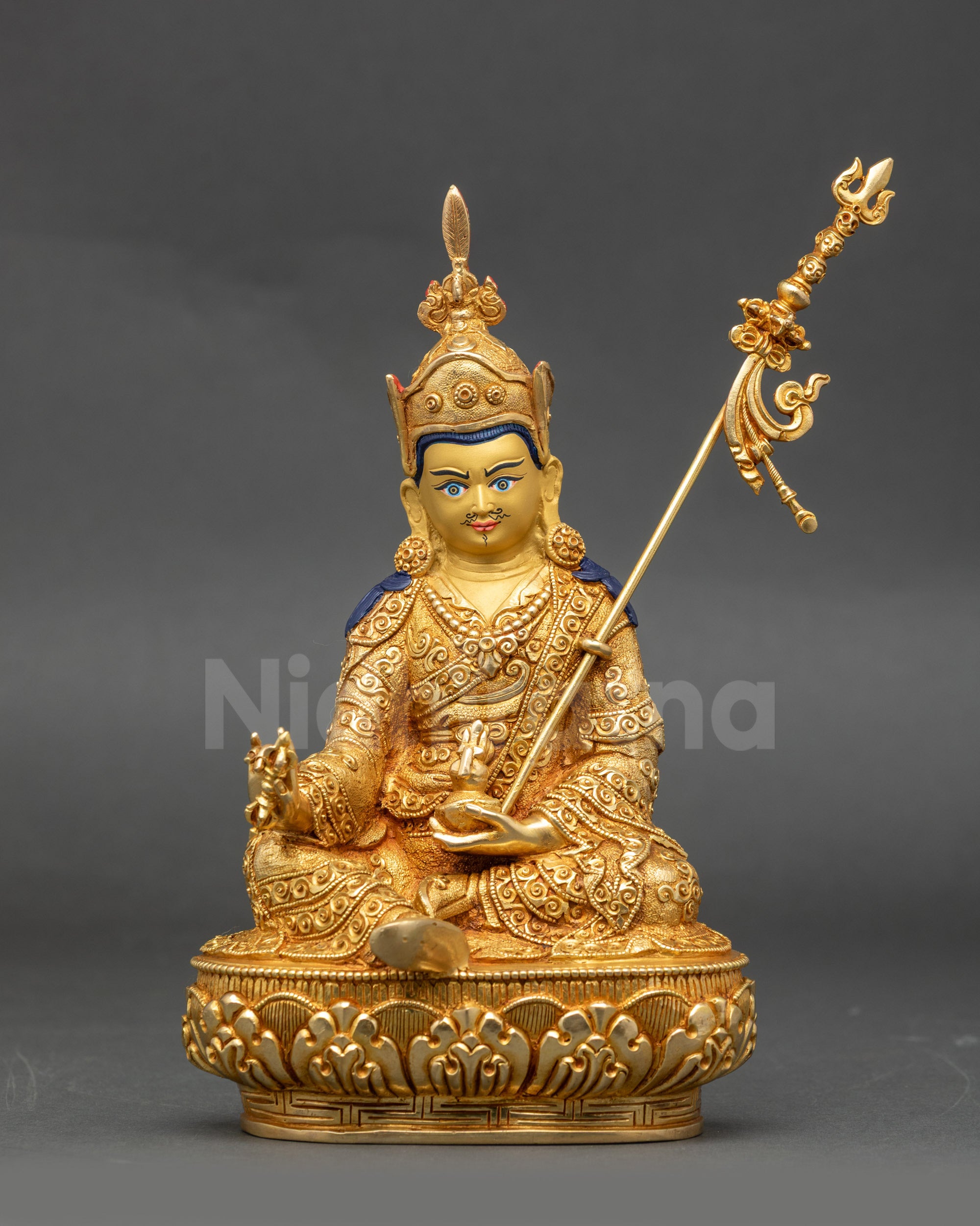 Front view of Guru Rinpoche gold-gilded copper statue seated in lotus posture