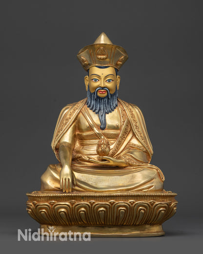 Front view of Guru Shapdum statue on lotus pedestal with gold-gilded face and robes
