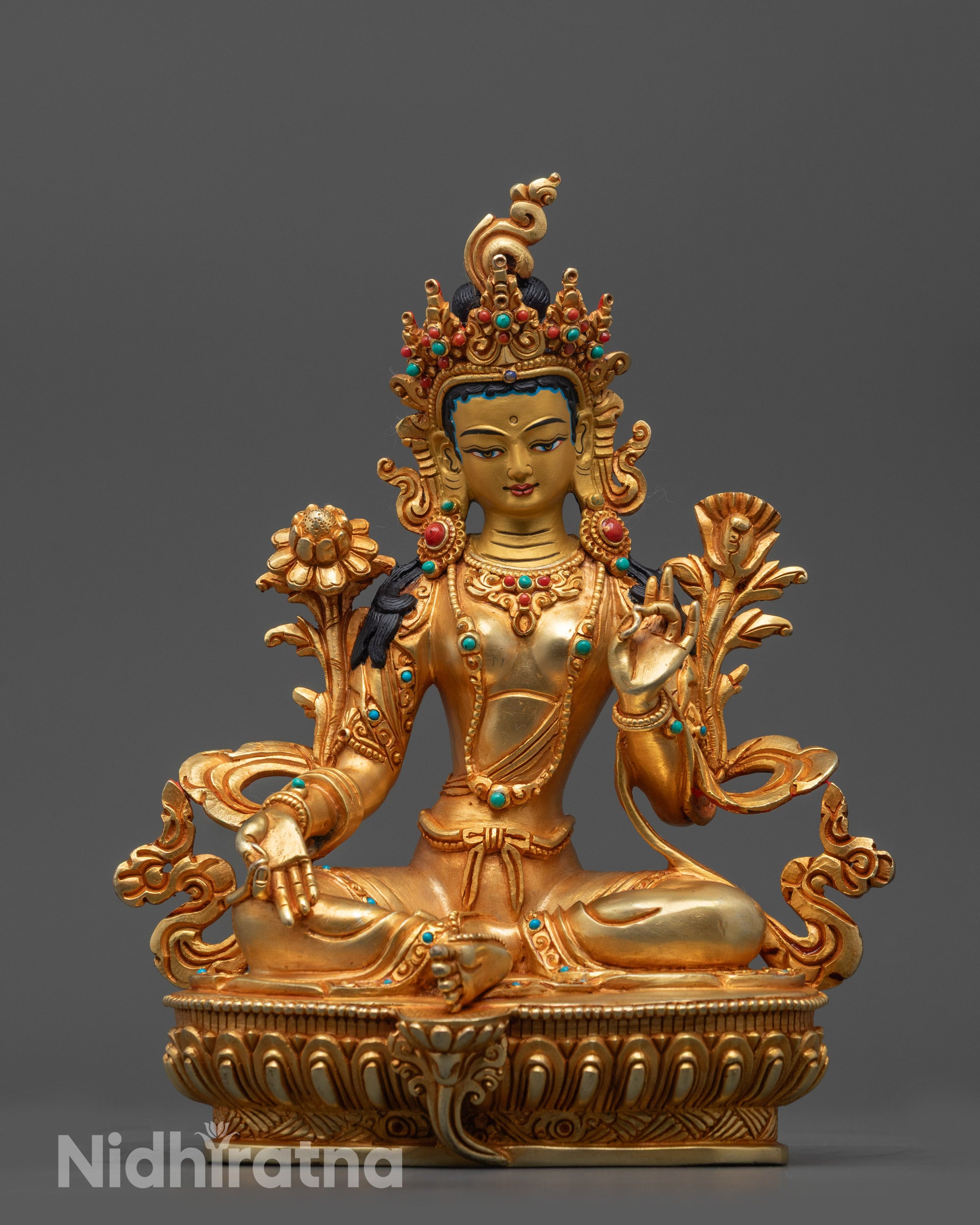 Front view of Hand-Carved Green Tara Statue with gold-gilded face and lotus seat details