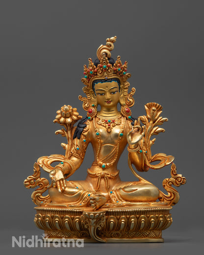 Front view of Hand-Carved Green Tara Statue with gold-gilded face and lotus seat details