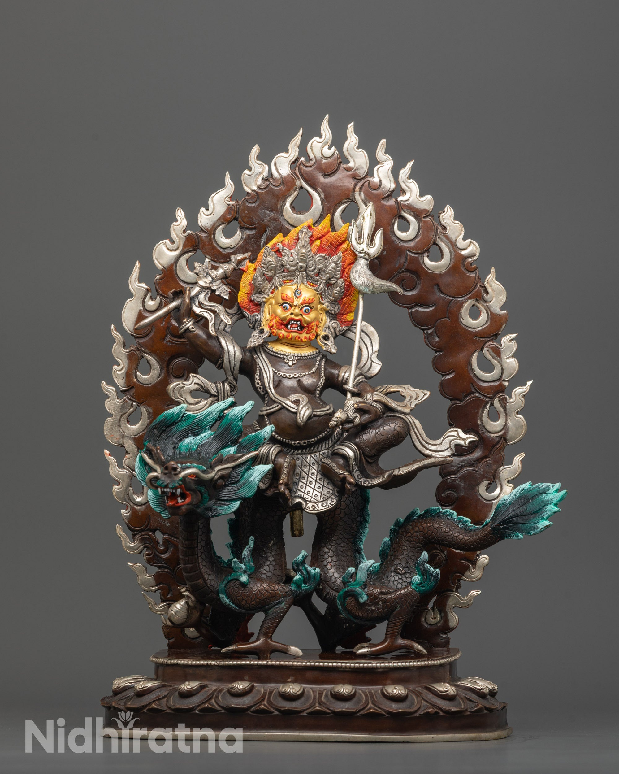 Front view of Hand-Finished White Dzambhala Statue showing gold-gilded face and oxidized copper.